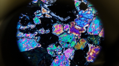 microscopic slice of iridescent rock
